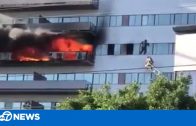 Fire at LA high-rise building — man clinging to window rescued!